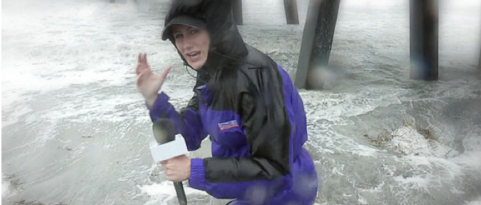journalist reporting during a storm