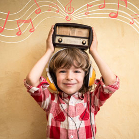 Child holding vintage radio
